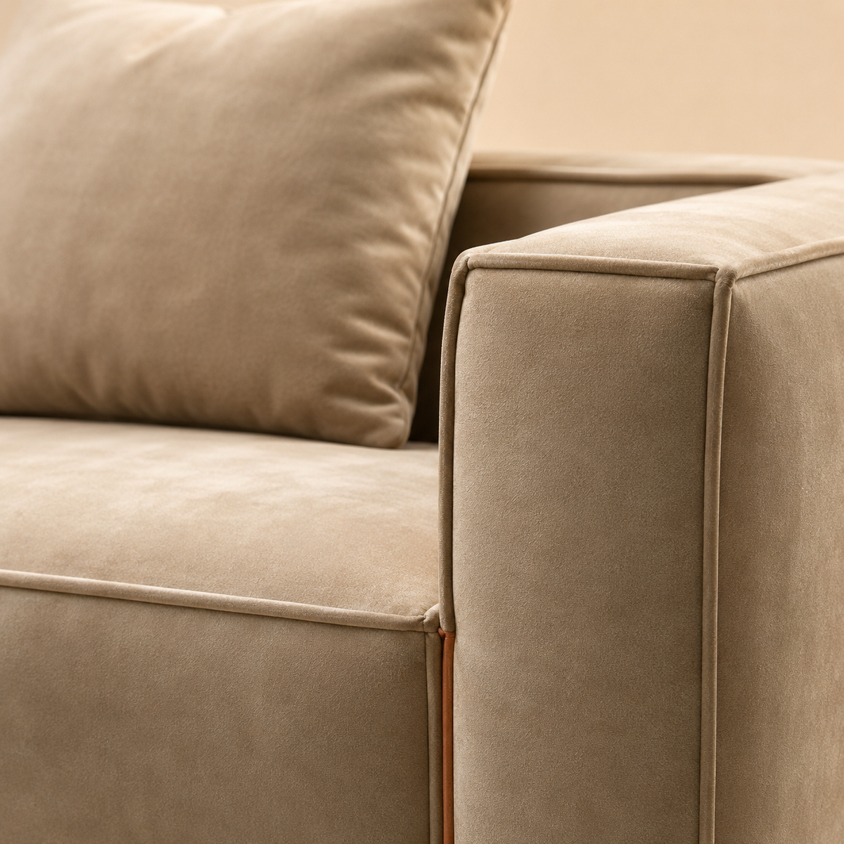 Close view of the Chamois Sofa arm, the cord turning the corner and the tan leather tab below it